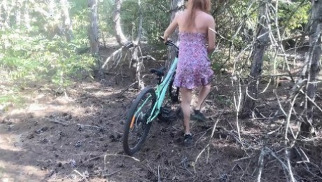 Found cute tattoed girl riding bicycle in the forest and fucking her hairy pussy